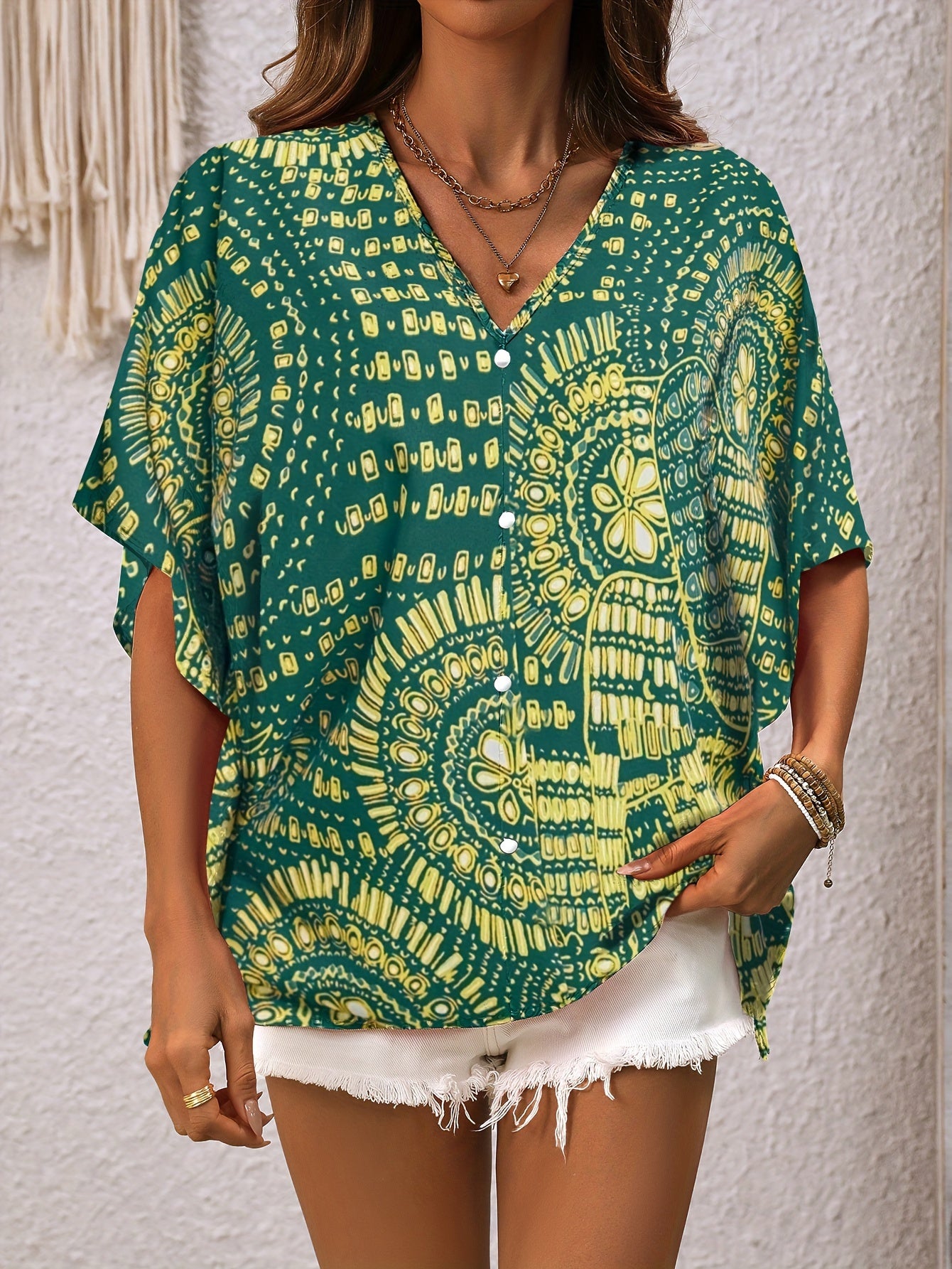 Mandalamönstrad topp med fladdermusärm